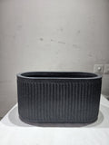 GoHooked Aurelia large oval floor planter with a modern vertical ribbed texture in a dark grey speckled finish.