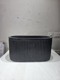 GoHooked Aurelia large oval floor planter with a modern vertical ribbed texture in a dark grey stone-like finish.