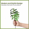 GoHooked artificial Philodendron Mamei plant with 12 green patterned polyester leaves, held in a hand.