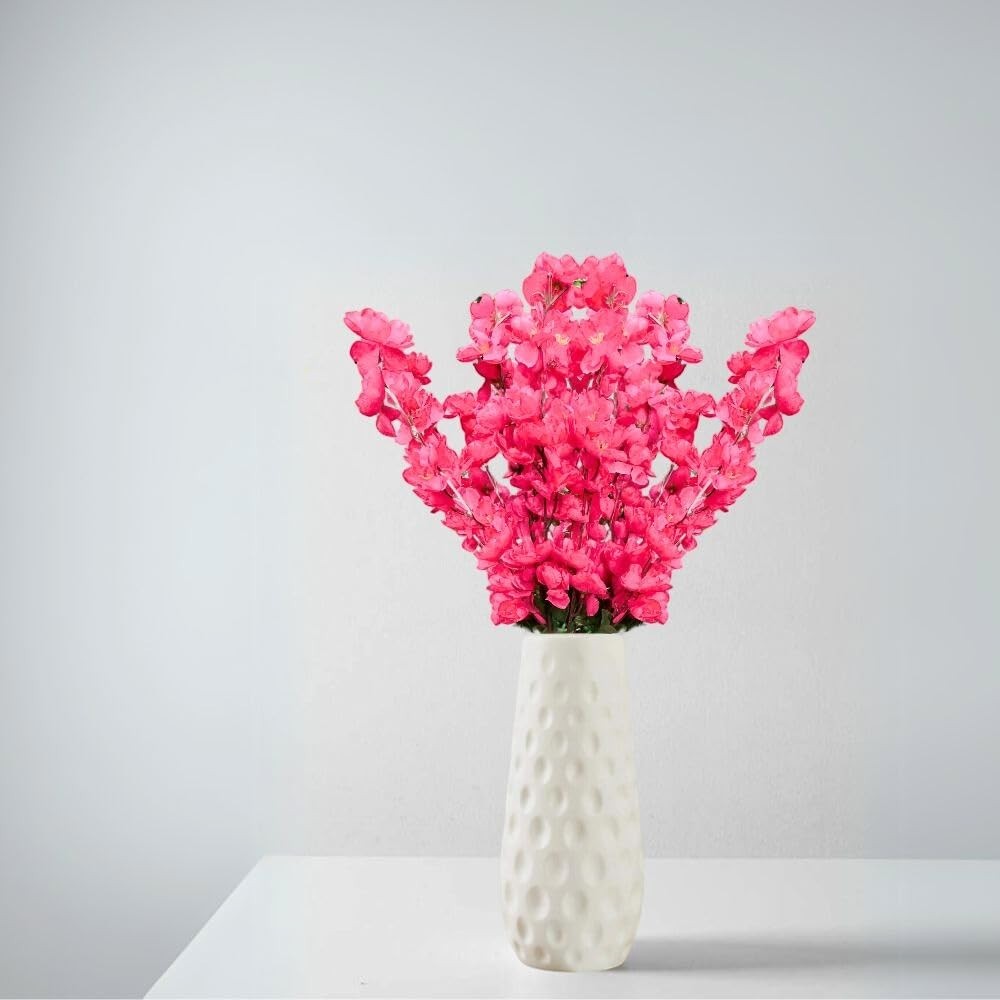 Go Hooked pink artificial flowers in a white textured ceramic vase, perfect for home or office decor.
