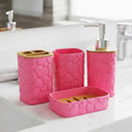 Go Hooked pink plastic bathroom accessory set with heart embossed design. Includes soap dispenser, tumbler, soap dish, and toothbrush holder.