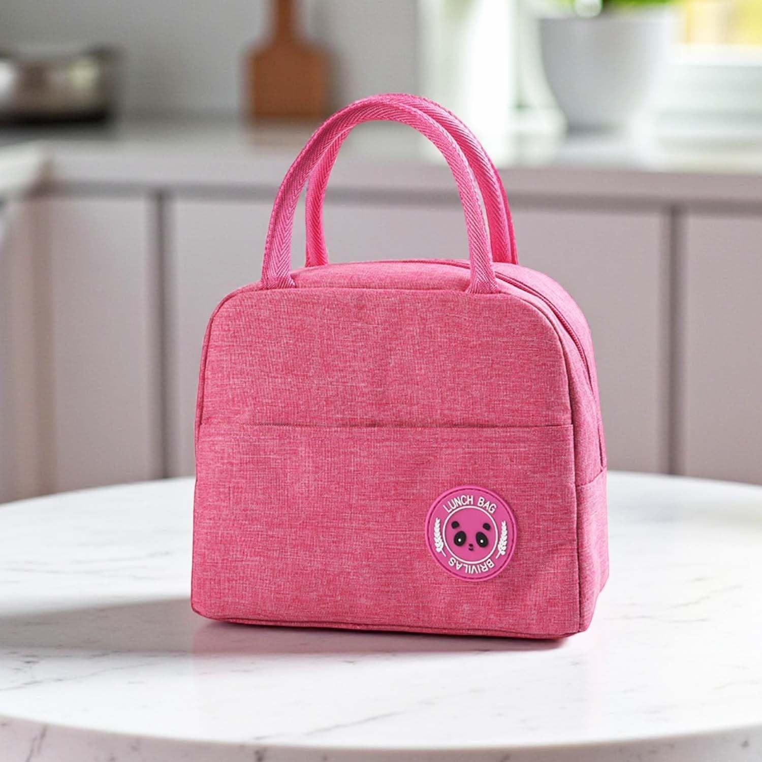 Go Hooked pink insulated lunch bag with dual handles and a panda patch. Made of Oxford cloth, perfect for school or travel.