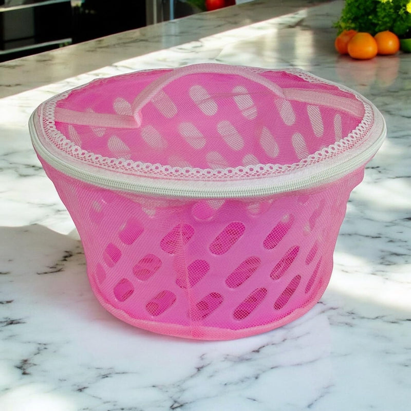 Go Hooked pink mesh storage basket with zip-close net cover and decorative trim. Breathable, insect-proof design.