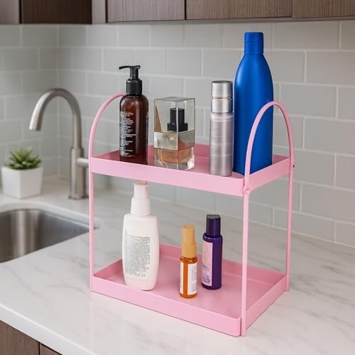GoHooked pink metal 2-tier standing rack organizer for bathroom or kitchen countertop storage. Holds cosmetics, spices, and bottles.