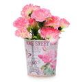GoHooked pink metal planter with Eiffel Tower and floral design, holding artificial pink carnations.