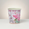 GoHooked pink metal planter with Eiffel Tower, roses, and butterfly design. Home Sweet Home text.