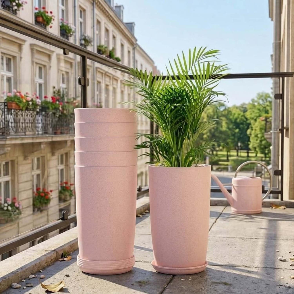 GoHooked set of 3 pink speckled plastic planters with saucers, one filled with a palm plant.
