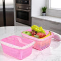GoHooked pink plastic storage basket with zip net cover, holding fruits like grapes, apples, and bananas.