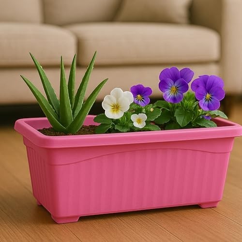 GoHooked pink rectangular plastic planter with ribbed sides, holding an aloe plant and pansies.