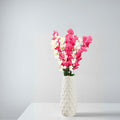 GoHooked pink and white artificial flowers in a textured white ceramic vase. Realistic faux blossoms for home decor.