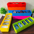 Go Hooked set of 8 multipurpose plastic drawer organisers in assorted bright colours, holding socks and underwear.