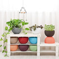 GoHooked 7-piece set of multicolour plastic hanging planters with woven texture. Ideal for indoor/outdoor use.