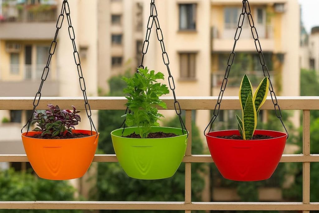 GoHooked set of 3 plastic hanging planters in orange, green, and red, with metal chains, perfect for balconies and gardens.