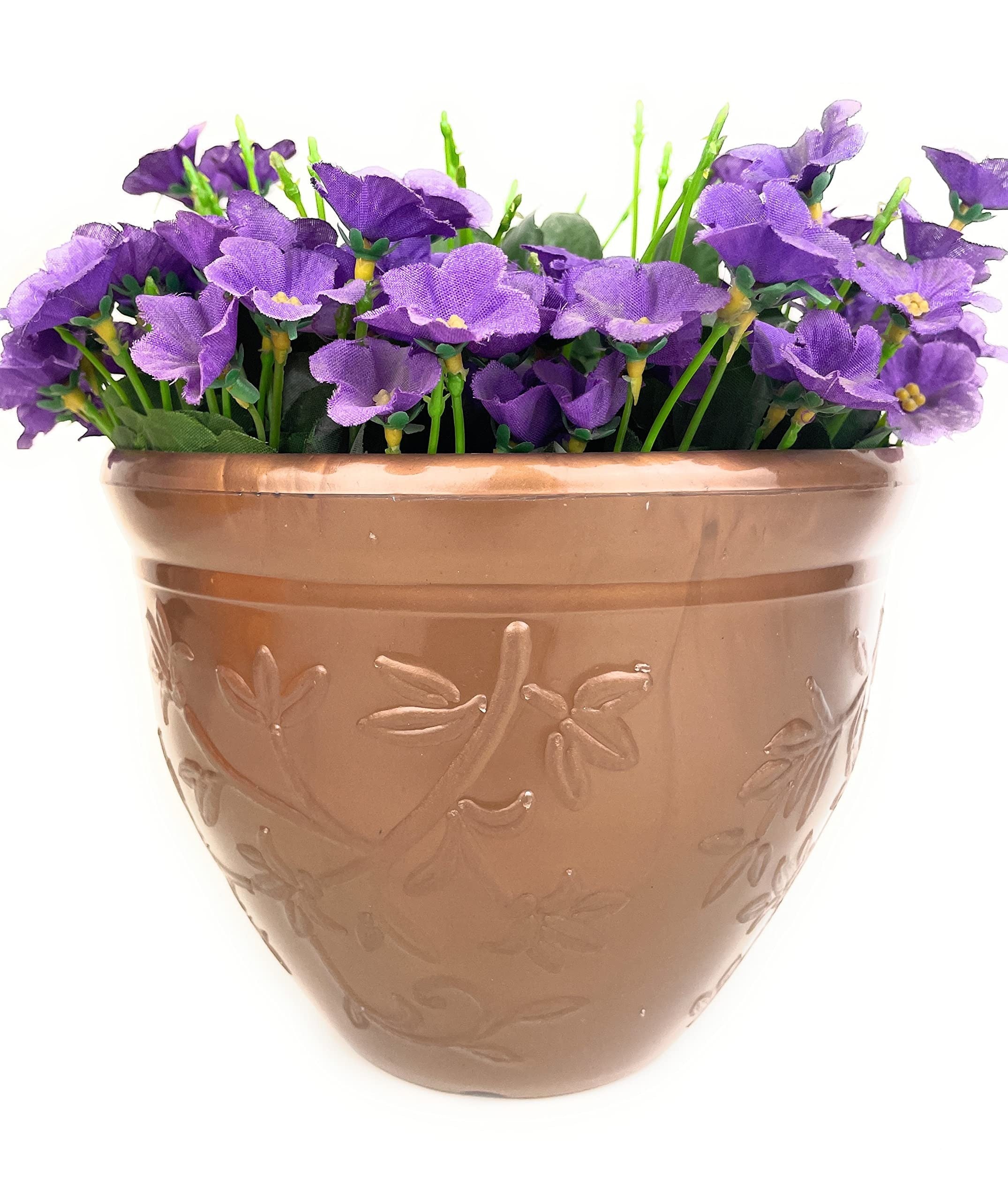 GoHooked copper-colored plastic planter pot with embossed floral design, filled with purple artificial flowers.