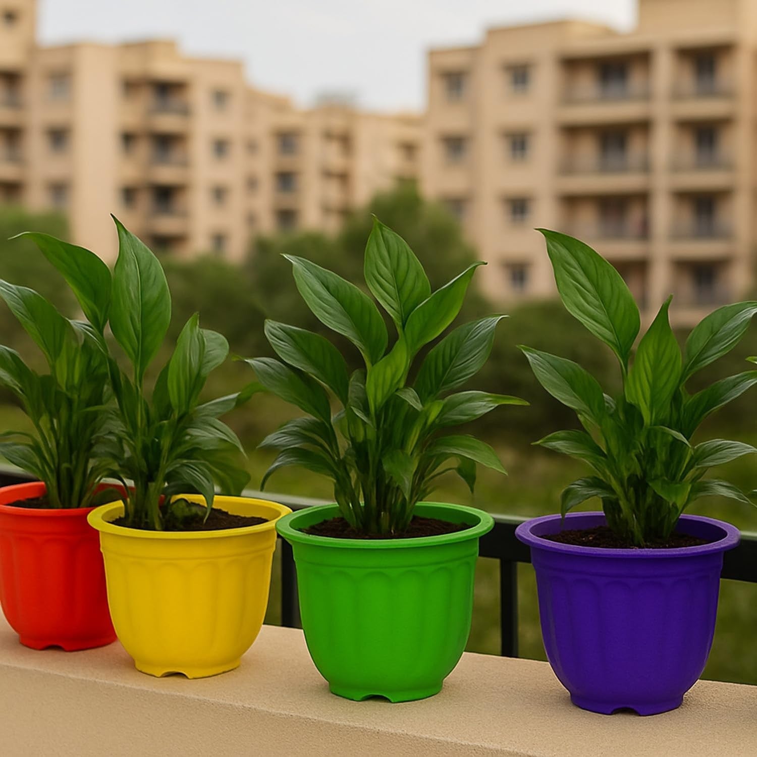 GoHooked set of 4 colorful plastic planters: red, yellow, green, and purple. Lightweight, durable, and modern design for indoor/outdoor use.
