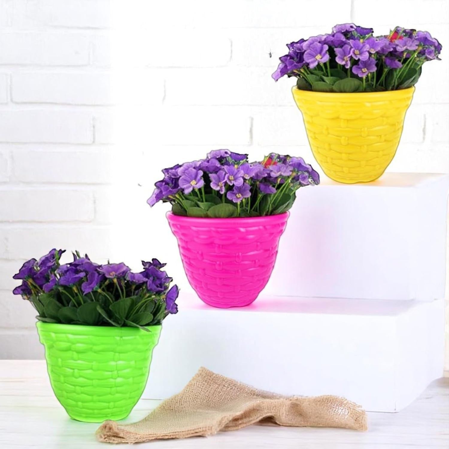 GoHooked set of 4 multicolor plastic planter pots with woven texture, perfect for indoor or outdoor plants.