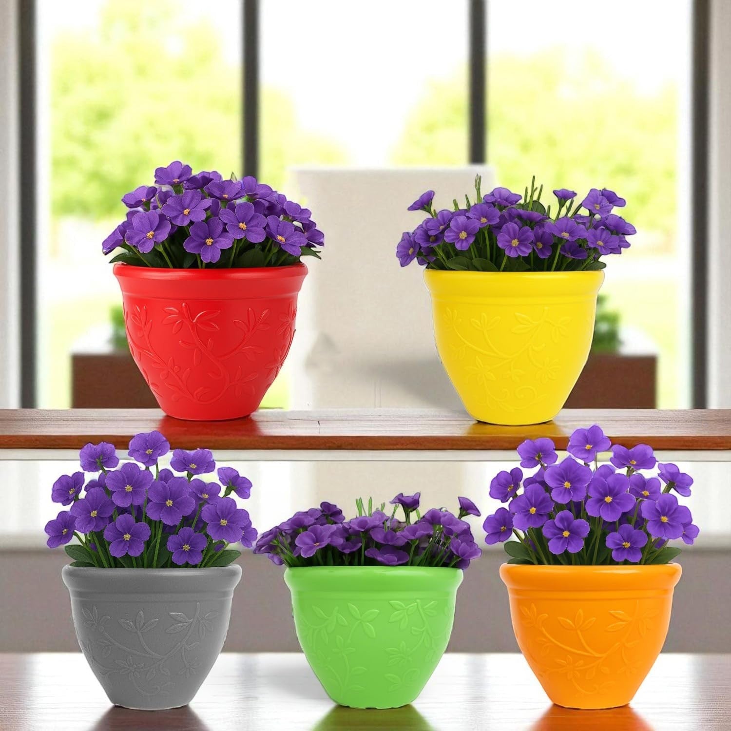 GoHooked set of 5 multicolor plastic planter pots with embossed floral design, holding purple flowers. Ideal for indoor/outdoor use.