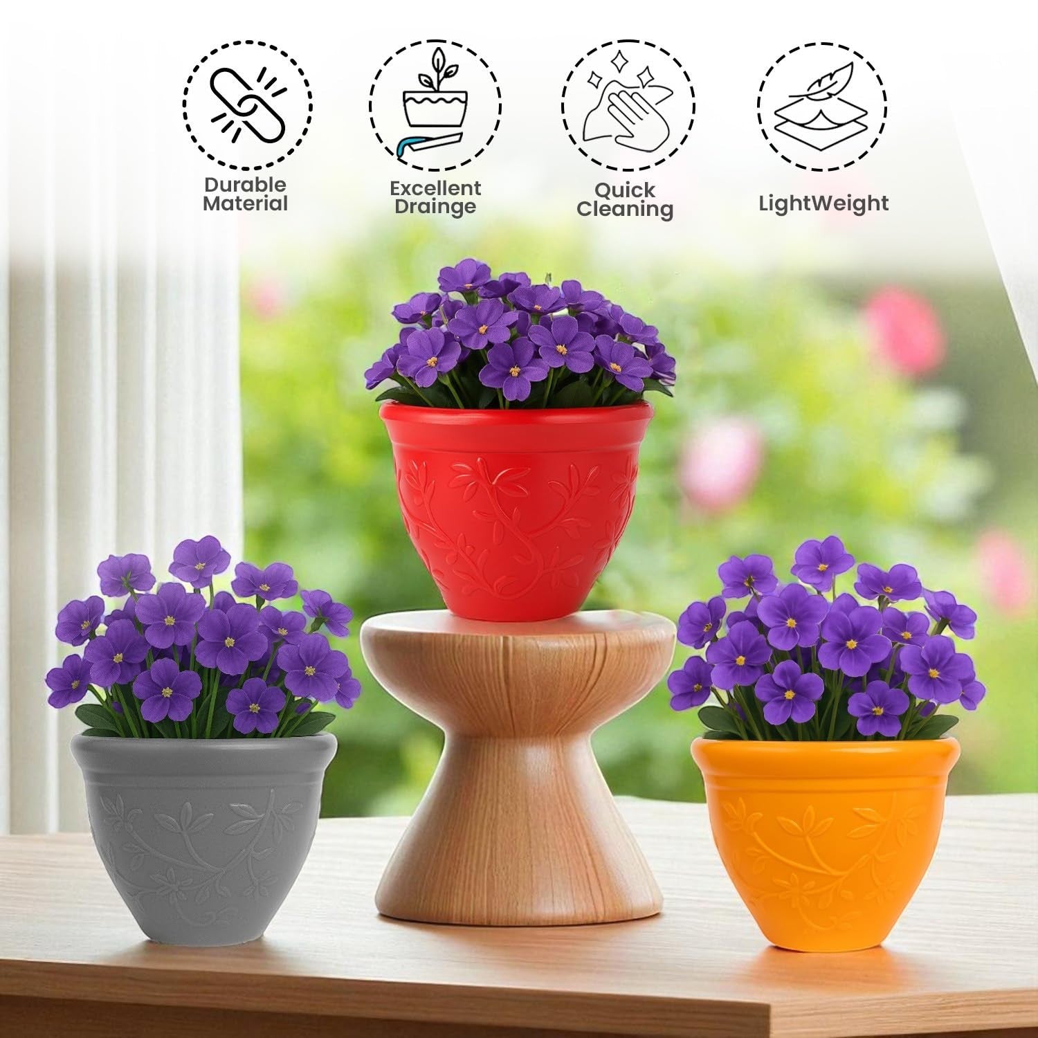 GoHooked set of 3 multicolor plastic planter pots with embossed floral design. Red, grey, and yellow pots.