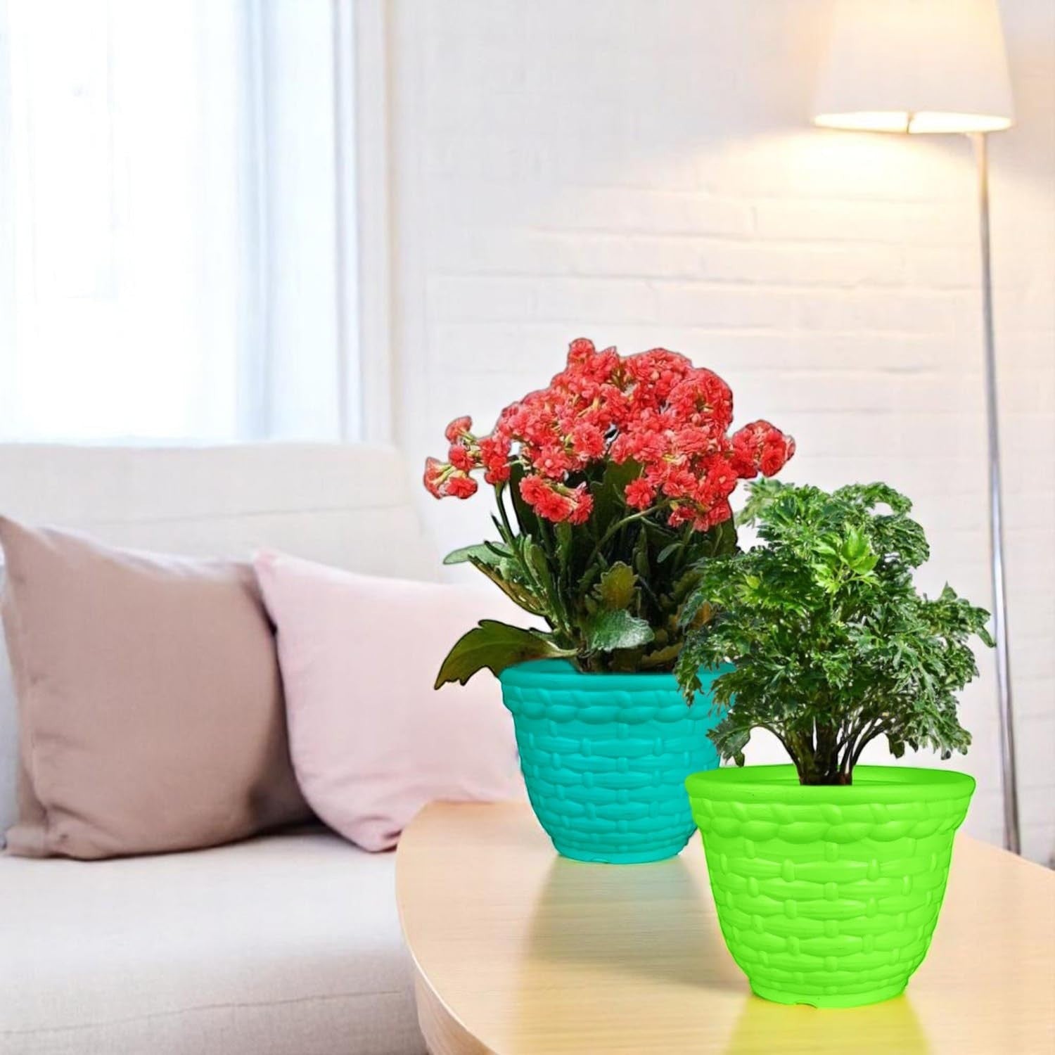 GoHooked set of 3 multicolor plastic planter pots with woven texture. One teal pot with red flowers, one lime green pot with green plant.