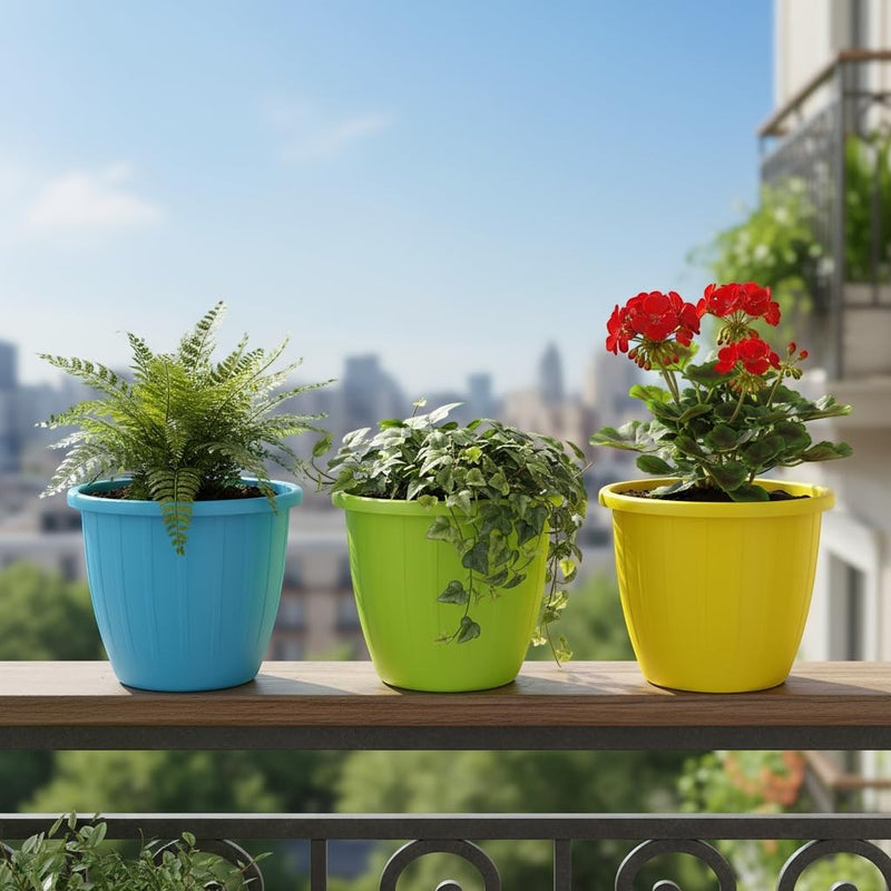 GoHooked set of 3 plastic planters in blue, lime green, and yellow, holding plants on a balcony.