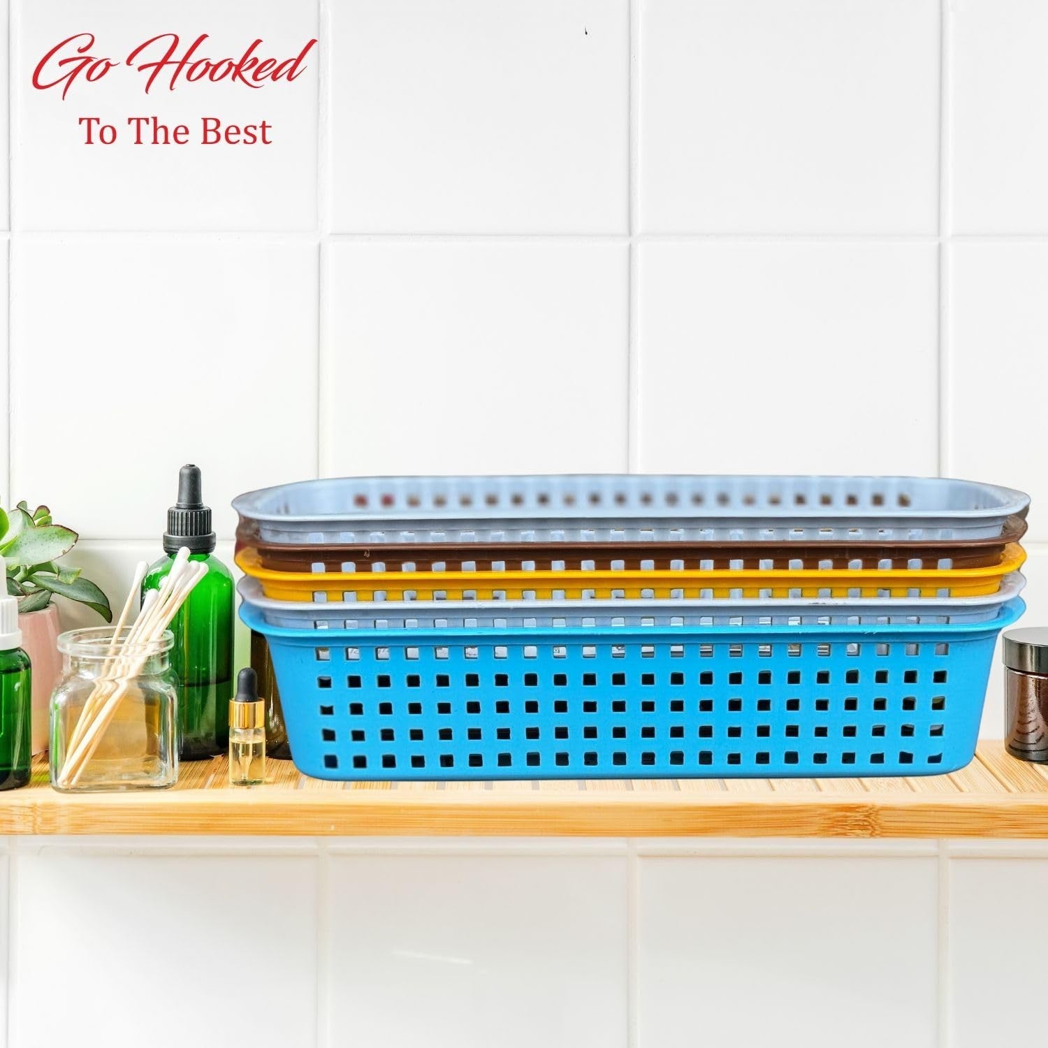 GoHooked multicolour plastic storage baskets, stack of 4, with perforated sides, ideal for bathroom organization.