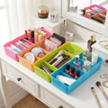 Go Hooked multicolour plastic 5-grid storage box organiser for makeup, nail polish, and brushes. Space-saving design.