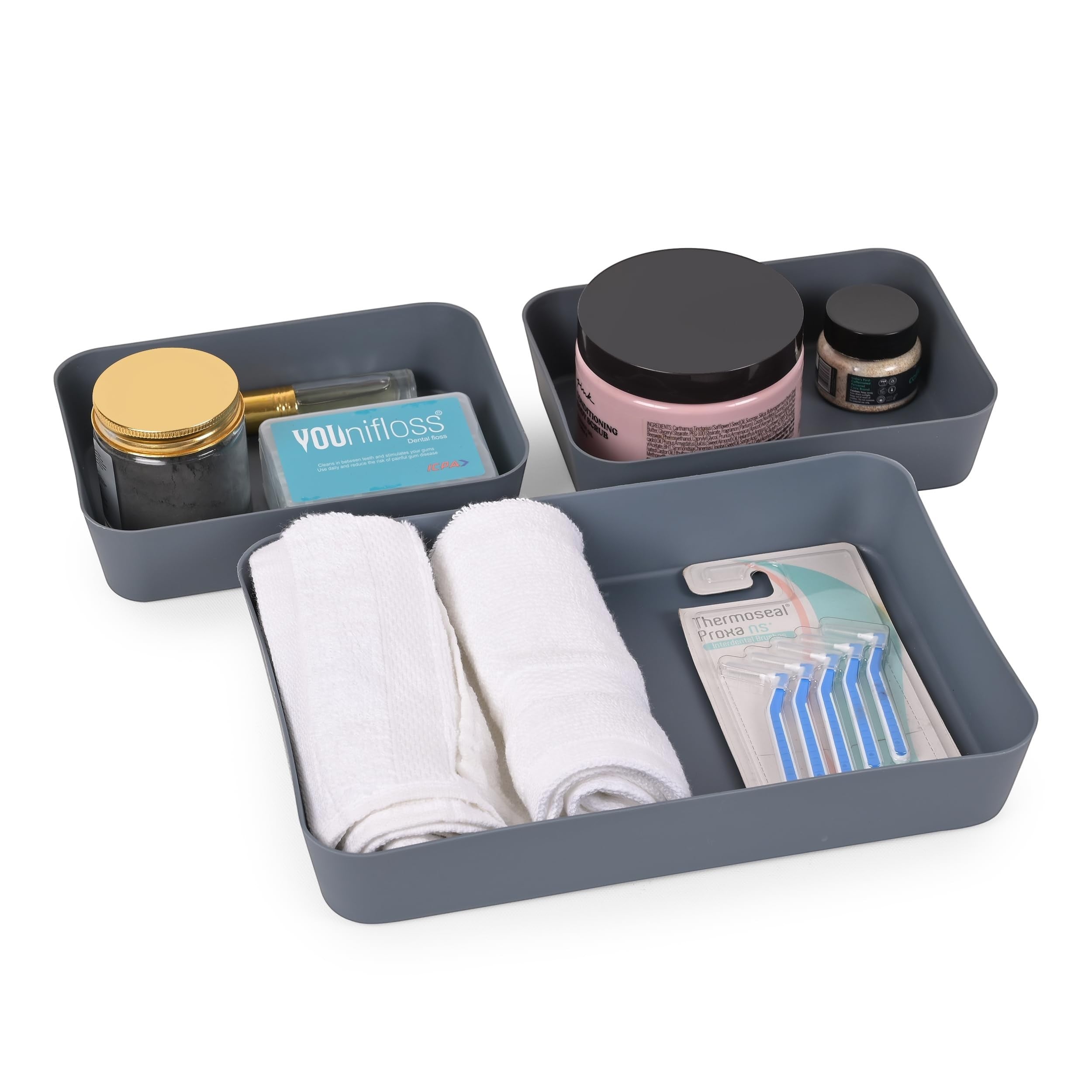 GoHooked set of 3 dark grey plastic storage trays with makeup, floss, towels, and razors.