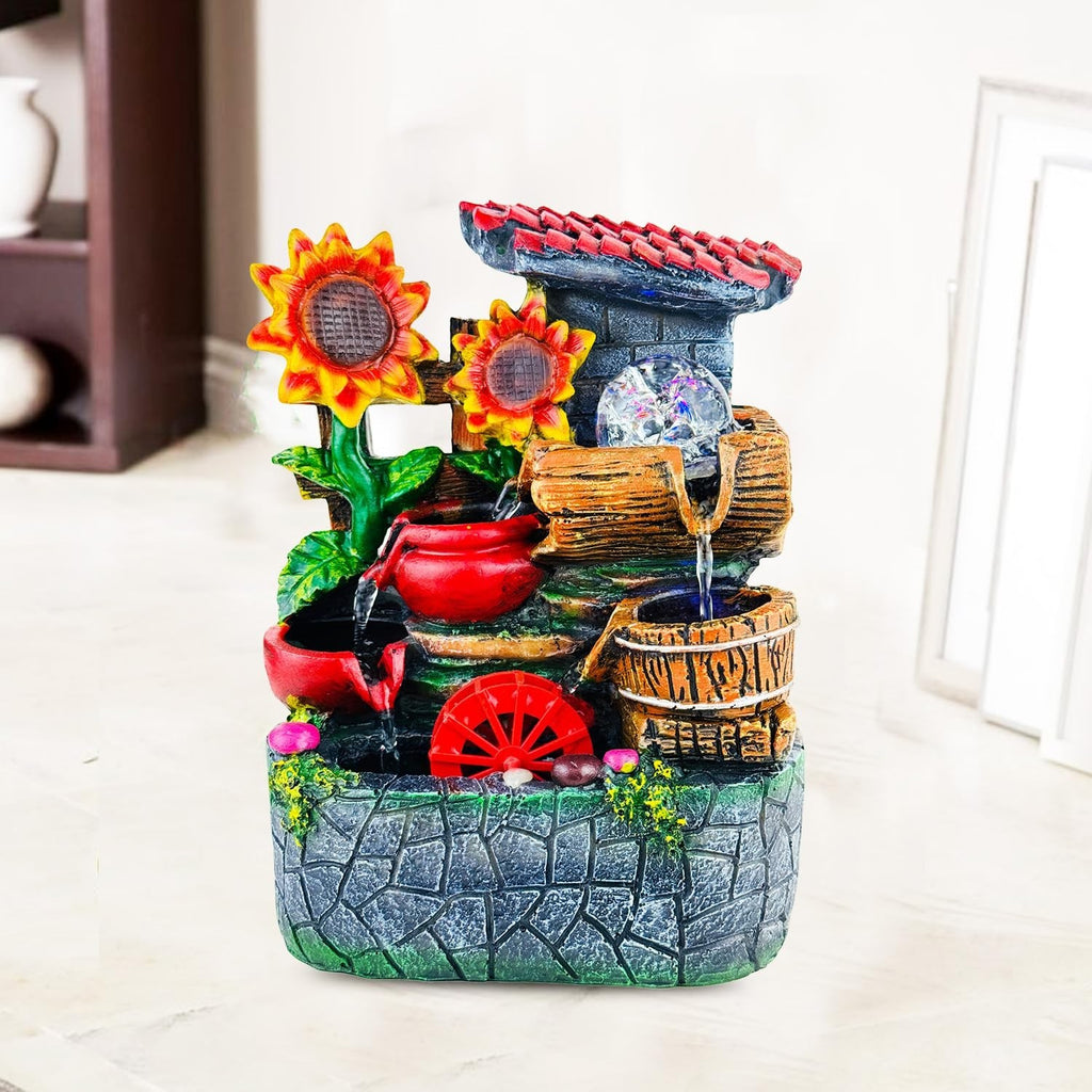 GoHooked multicolour polyresin tabletop waterfall fountain with LED lights and adjustable speed control, featuring sunflowers and a water wheel.
