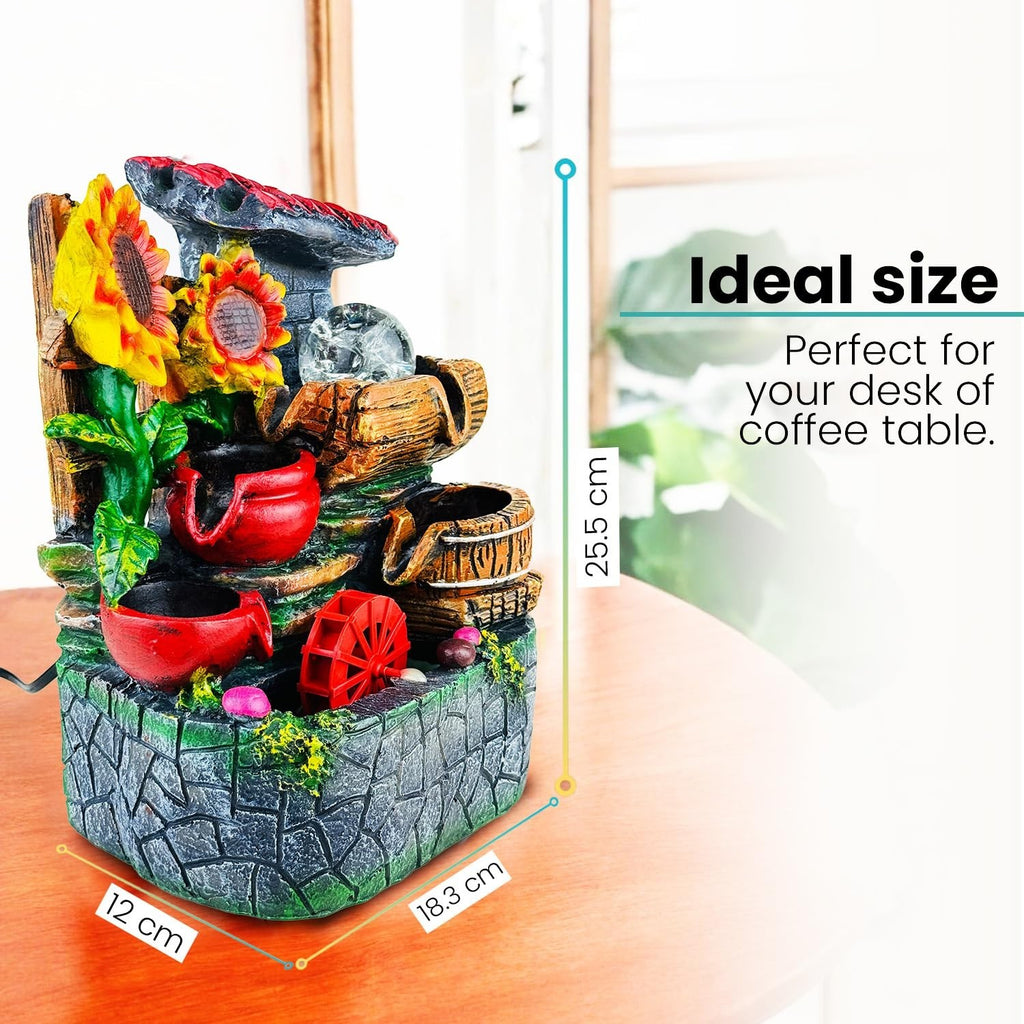 GoHooked multicolour polyresin tabletop waterfall fountain with sunflowers, red pots, and LED lights. Features adjustable speed control.