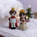 Go Hooked Prince and Princess couple figurines in resin, wearing crowns and royal attire. Ideal for cake decoration or home decor.