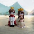 Go Hooked Prince and Princess couple figurines in white and gold, made of resin, perfect for cake decoration or home decor.