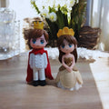 Go Hooked Prince and Princess resin figurines with gold crowns, red cape, and tan gown. Ideal for cake decor.