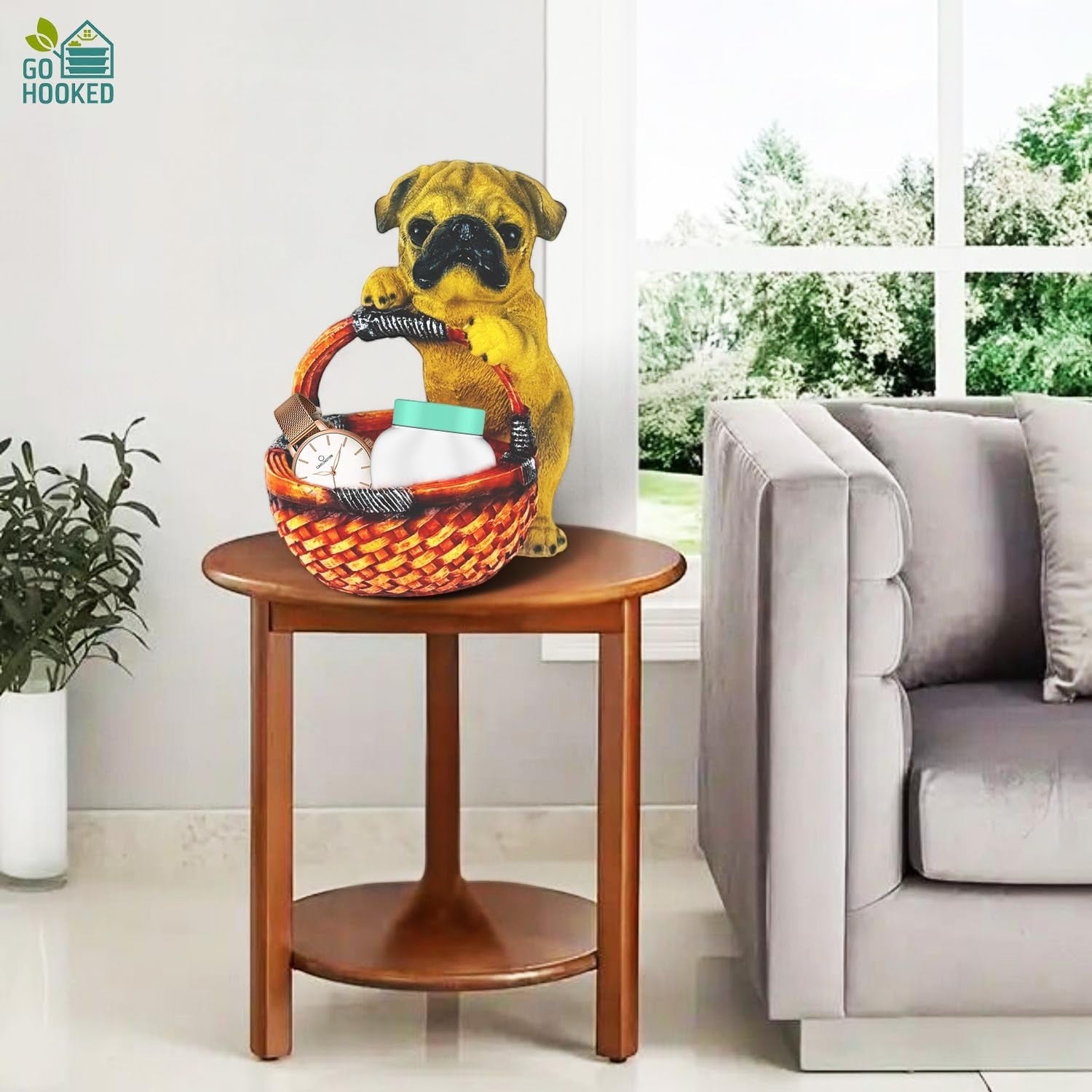 Go Hooked black pug dog figurine holding a woven basket for home decor. Resin showpiece for tabletop.