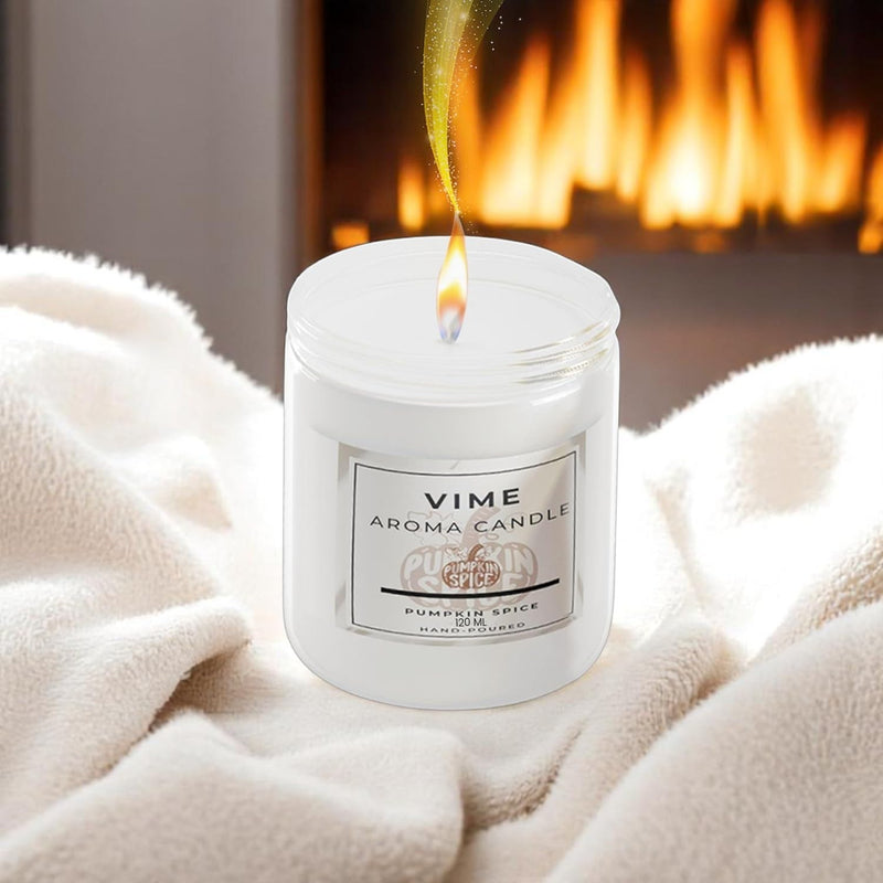 GoHooked white pumpkin spice scented aroma candle in a glass jar, lit flame, cozy home decor