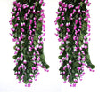 GoHooked pack of 2 purple artificial rose garlands with green leaves, 35 inch long, for home and party decor.
