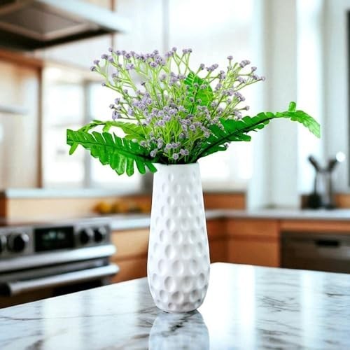 GoHooked white textured vase with purple baby's breath artificial flowers and green fern leaves.