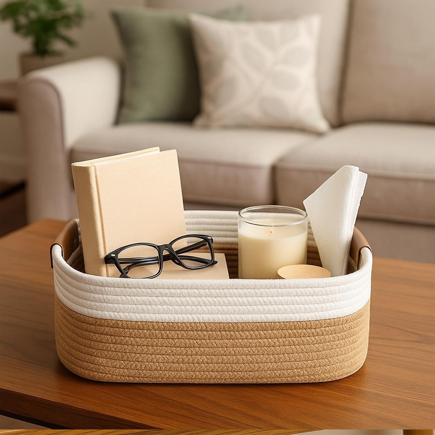 GoHooked beige and white rectangular cotton rope storage basket with soft handles, holding books, glasses, and a candle.