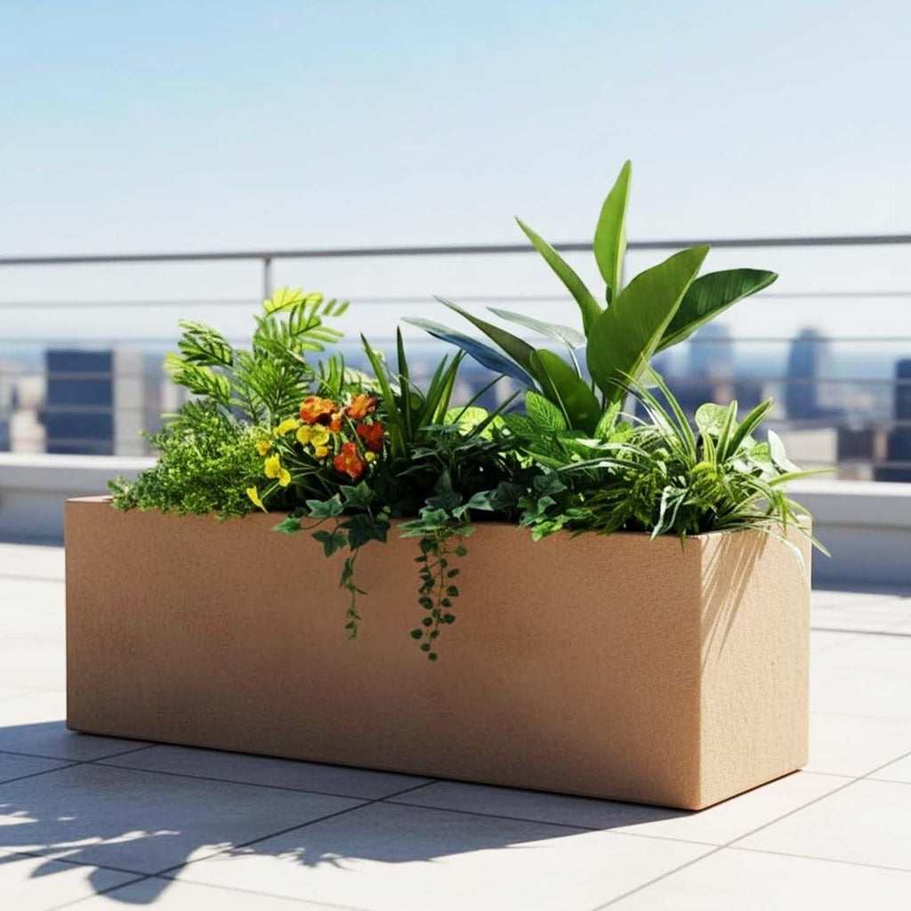 GoHooked rectangular sandstone polymer planter box filled with lush green plants and flowers on a sunny balcony terrace