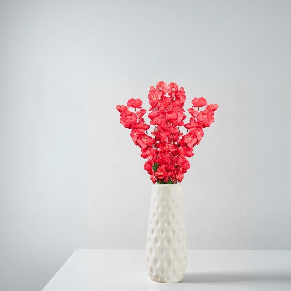 Go Hooked red artificial flowers in a white textured ceramic vase, perfect for home and office decor.