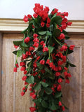 GoHooked red artificial rose garland, 35 inch, silk flowers and plastic stems, for home and party decor.