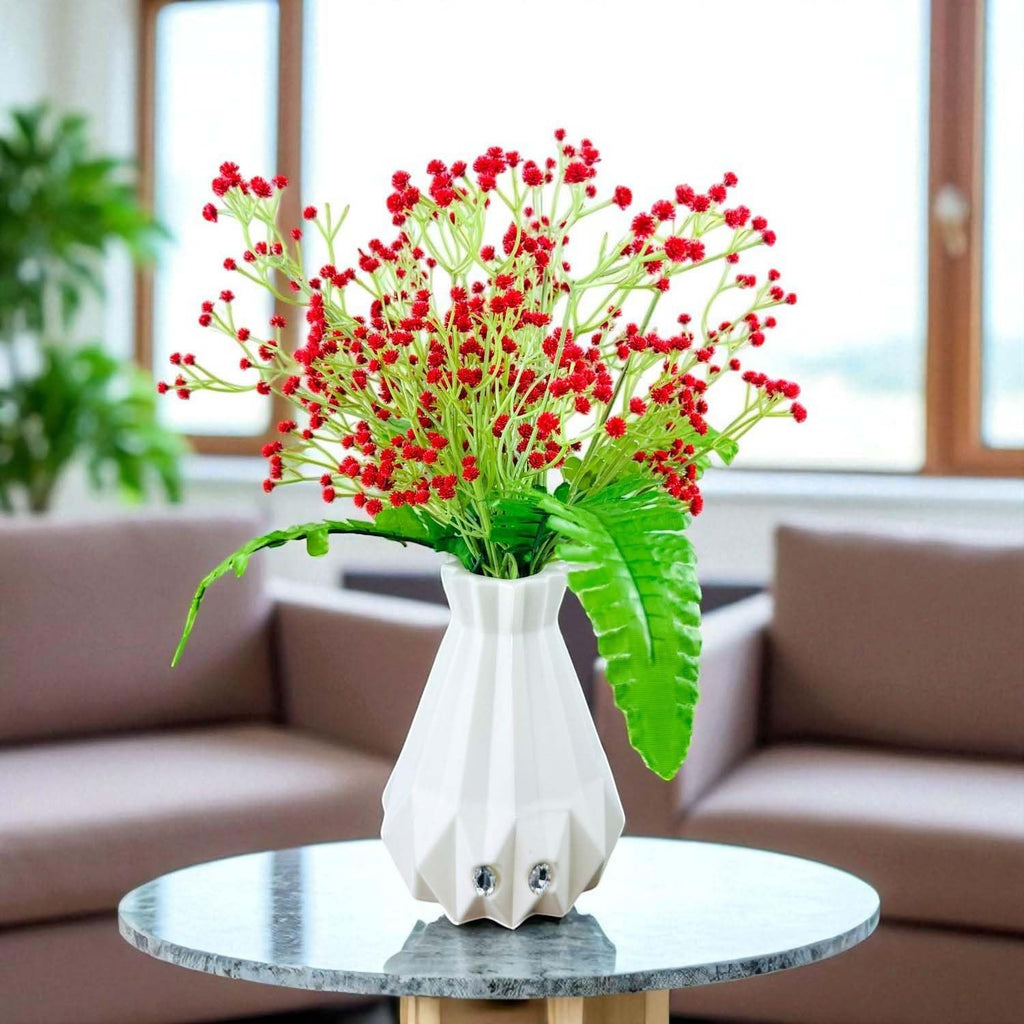 Go Hooked red baby's breath artificial flowers with fern leaves in a white geometric vase.