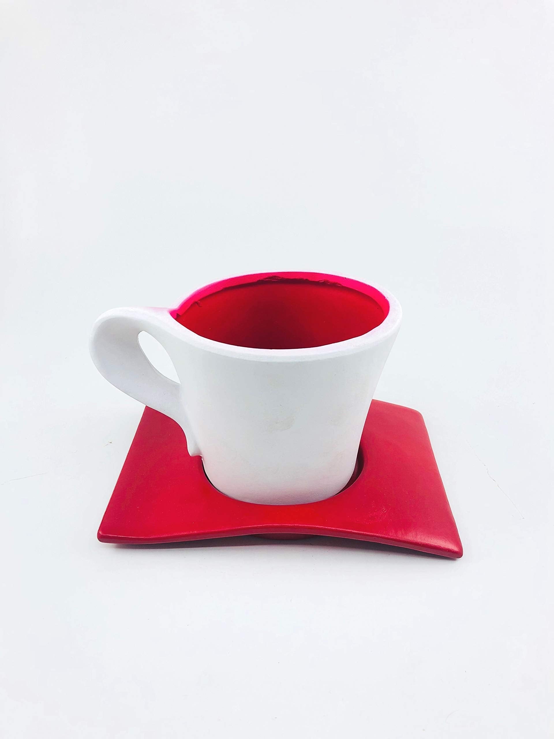 Go Hooked white ceramic planter shaped like a coffee cup with a red interior and a red saucer.