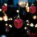 Go Hooked red gift box Christmas ornaments with gold hangers, festive home decor for trees, walls, and doors.