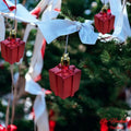 Go Hooked red gift box Christmas ornaments with gold tops hanging on a tree. Pack of 6.