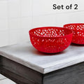 Go Hooked set of 2 red plastic fruit bowls with intricate cutout design. 21cm wide, 9.5cm high.