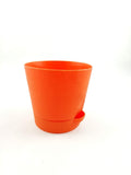 GoHooked red plastic planter with a self-watering spout. Ideal for patios and balconies.