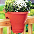 Go Hooked red plastic railing flower pot with white and yellow flowers, 12 inch diameter