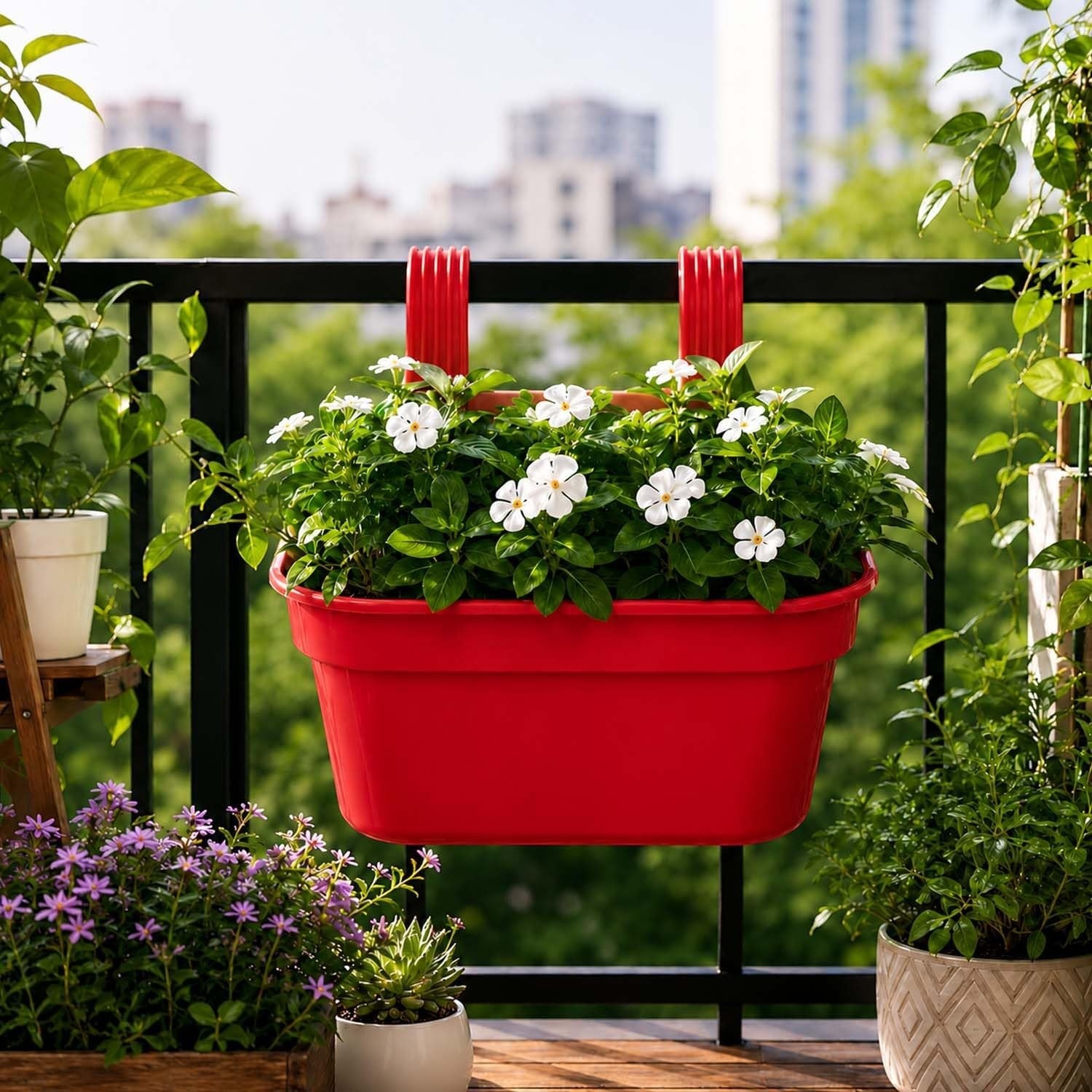 GoHooked red plastic railing hanging planter pot with white flowers, ideal for balconies and fences.