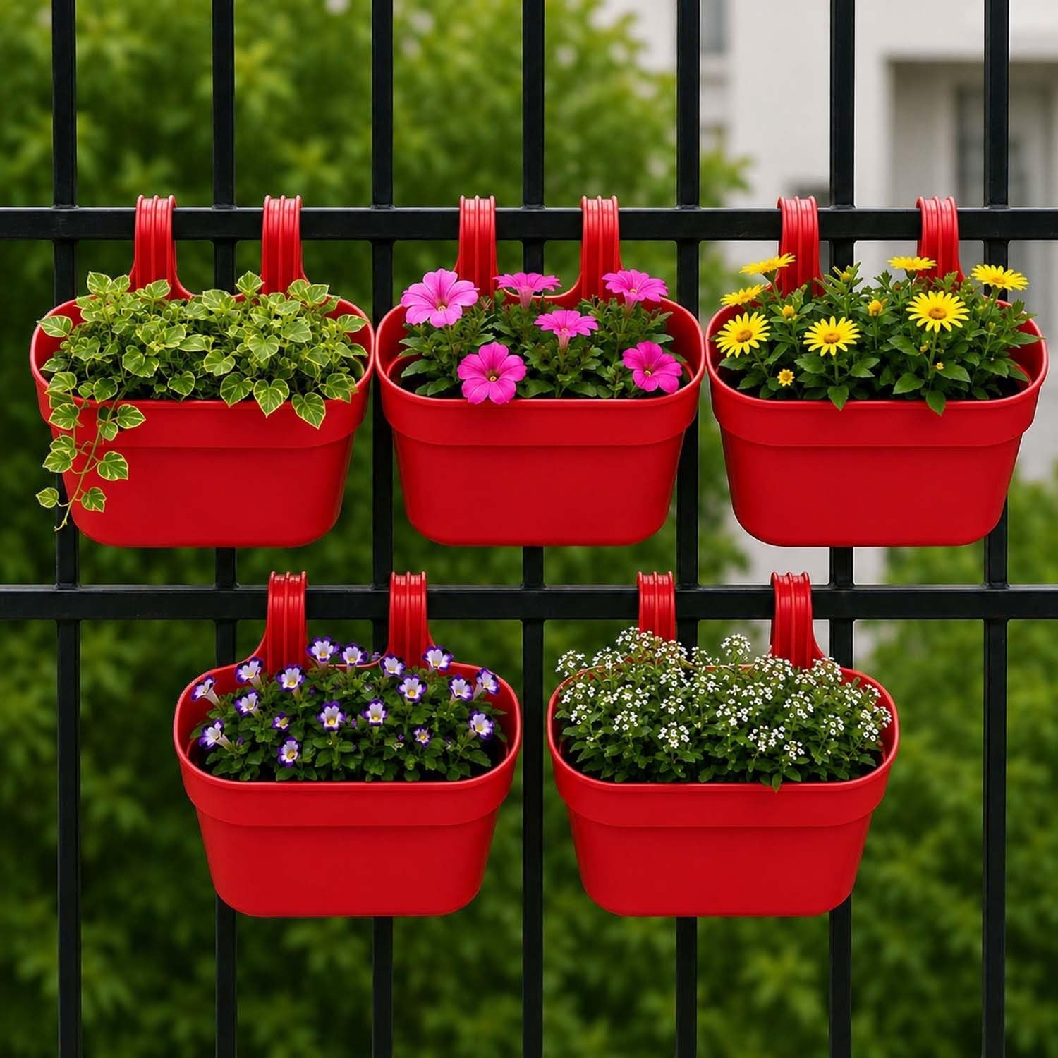 GoHooked red plastic railing hanging planters with pink, yellow, and purple flowers on a black fence.