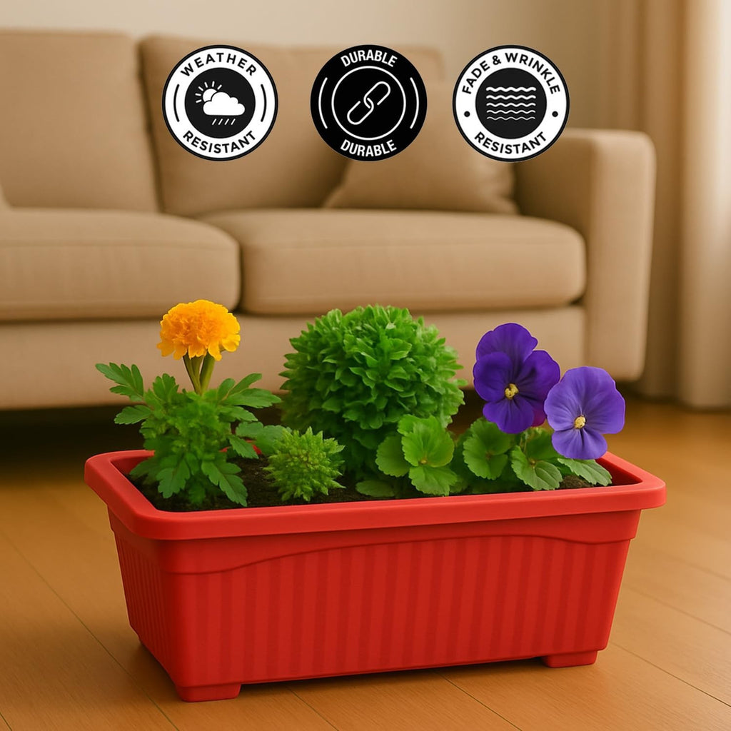 GoHooked red rectangular plastic planter with ribbed texture, holding yellow marigolds, green foliage, and purple pansies.